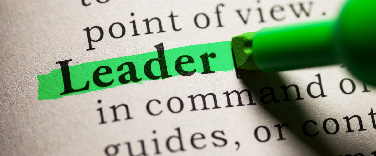 Close-up of a dictionary page showing the word Leader highlighted in green, representing the spiritual gift of intuition and directional leadership
