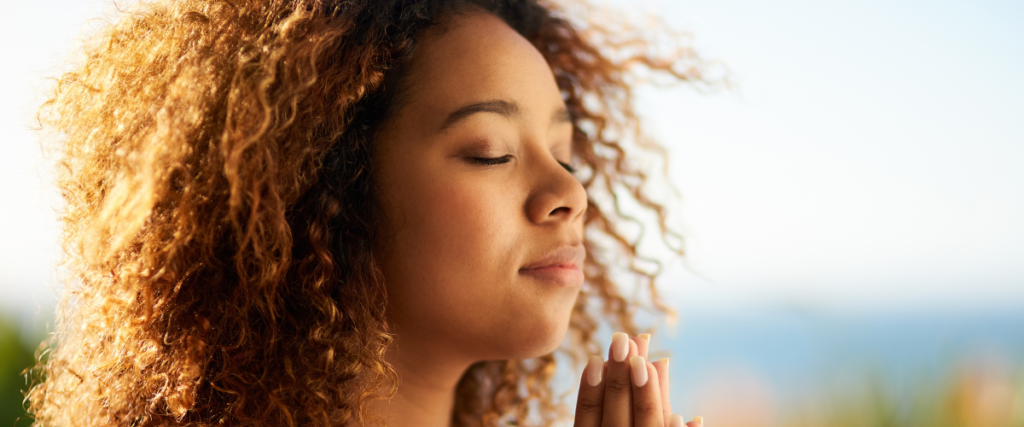 Woman with eyes closed in stillness practising claircognizance and inner knowing as part of the Prophetic spiritual gift