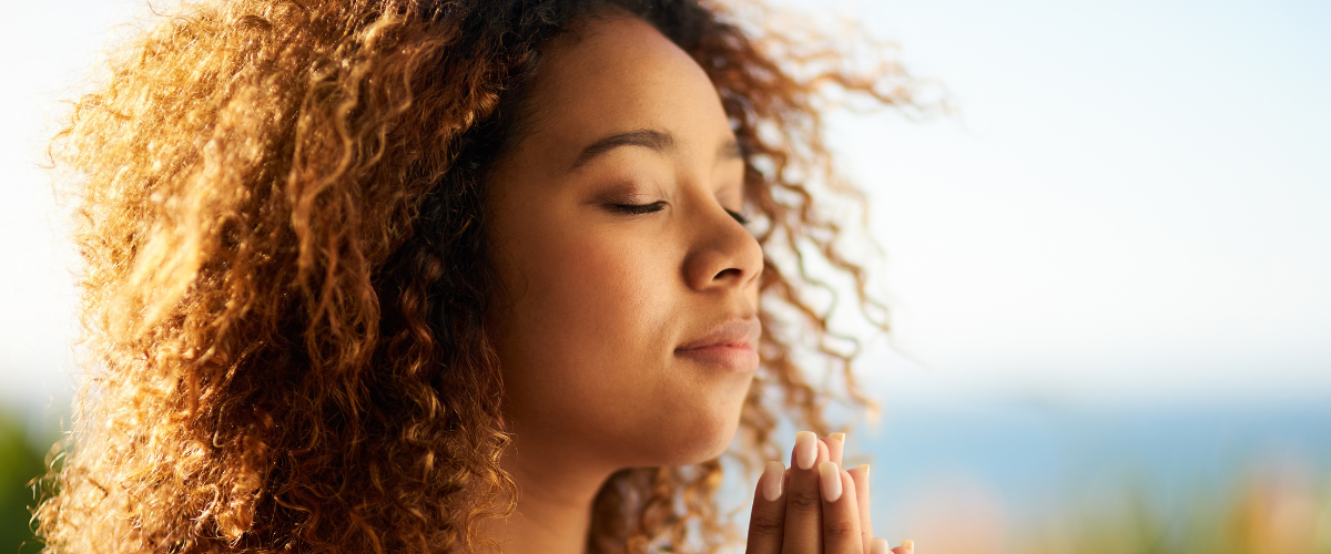 Woman with eyes closed in stillness practising claircognizance and inner knowing as part of the Prophetic spiritual gift